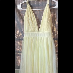 Long pastel yellow flowey dress